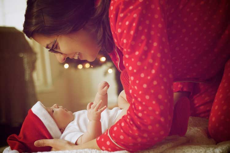 a mother holding her baby